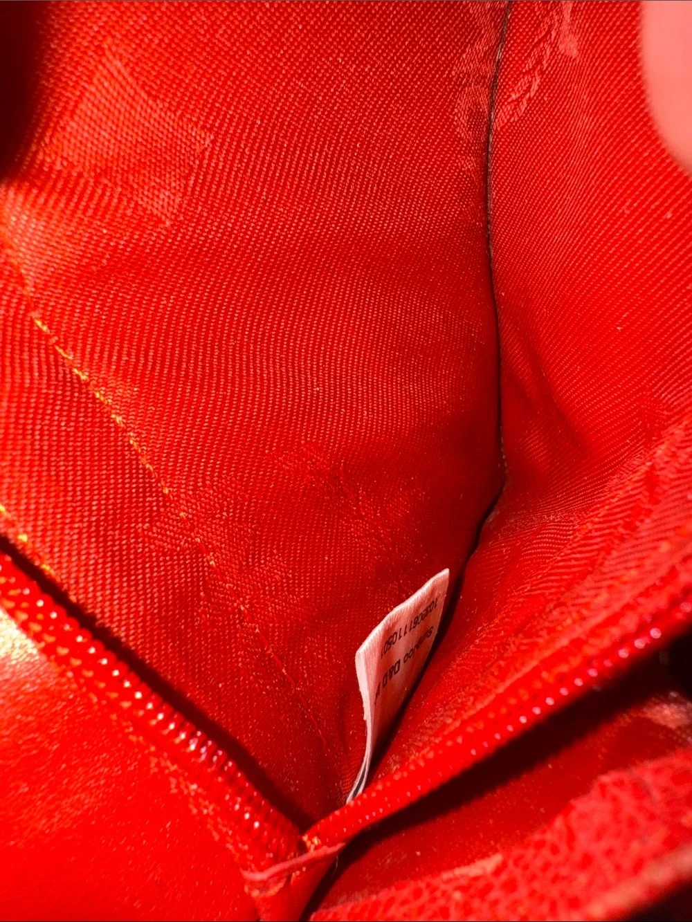 MCM Red Pebbled Leather Fold-Over Wallet.
